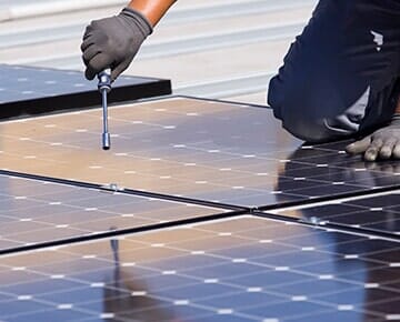 Electrician Installing Solar Panel — Electrical Services in Charlotte NC