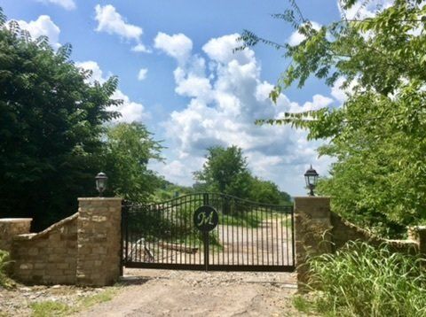 a gate with the letter m on it