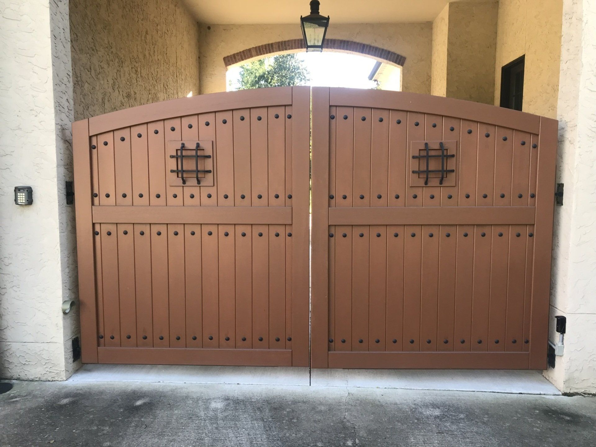 a brown wooden gate with a hashtag on it