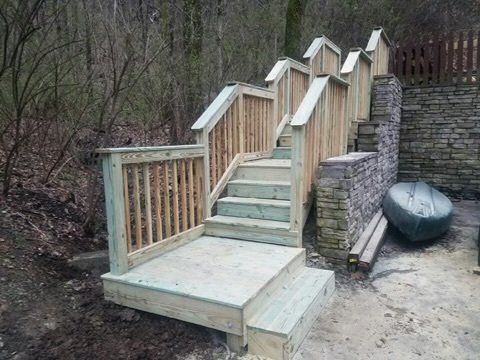 a wooden deck with stairs leading up to it