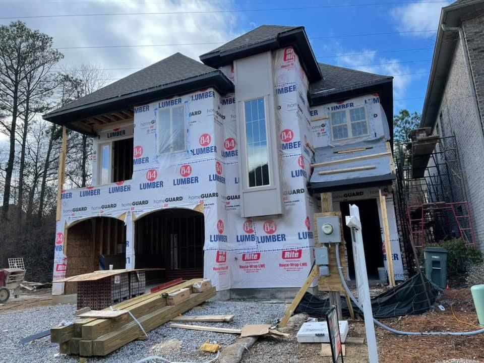 A house is being built in the middle of a forest.