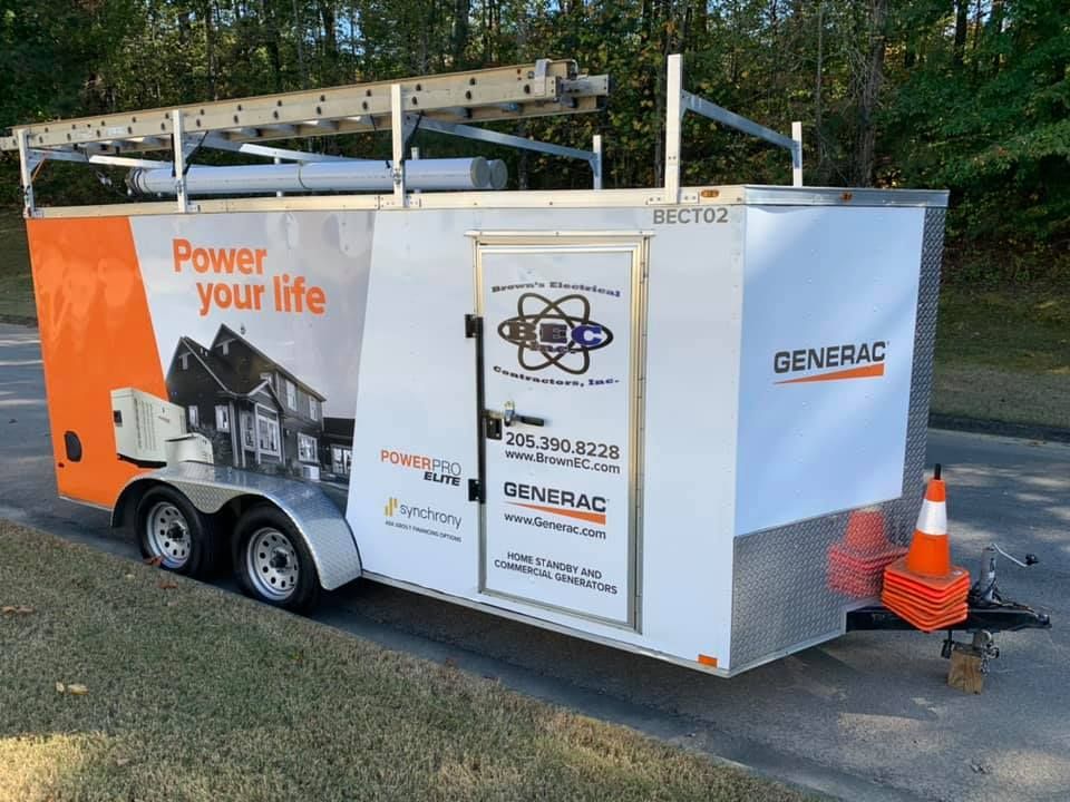 A generator trailer is parked on the side of the road.