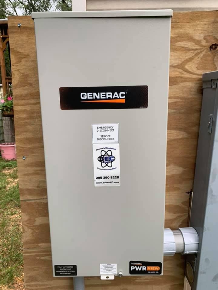 A generator is sitting on top of a wooden wall.