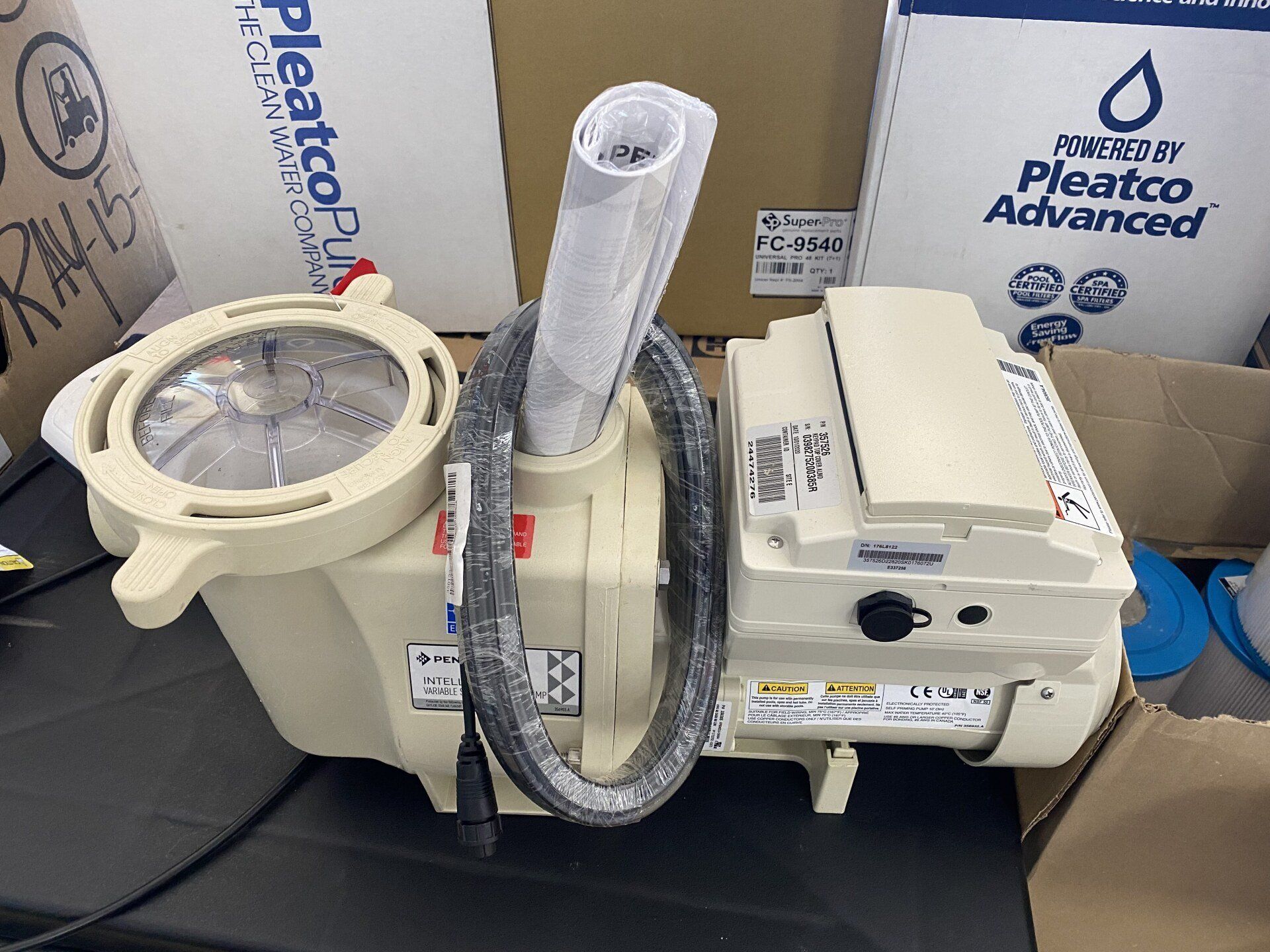 A pleatco advanced swimming pool pump is sitting on a table