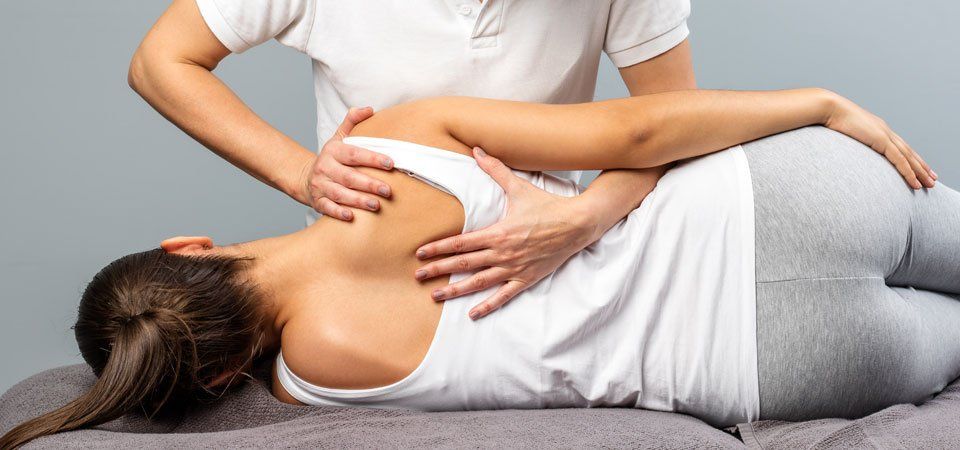 Treating back pain at In Touch with Health Osteopaths