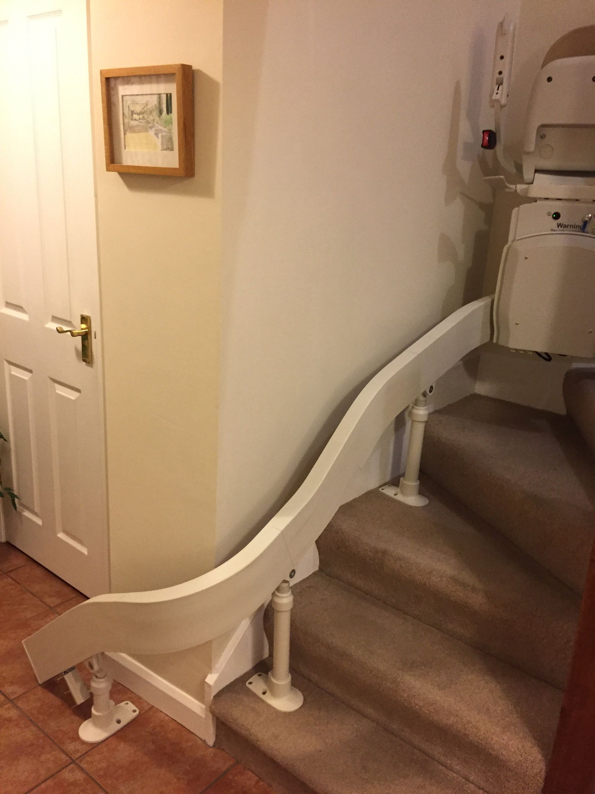 Reconditioned curved chair-lift, Congleton, Cheshire. Helping Hand Stairlifts.
