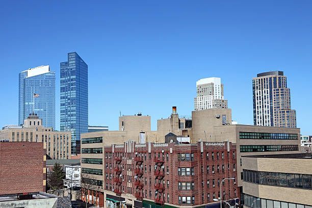 A city skyline with a lot of buildings and a blue sky