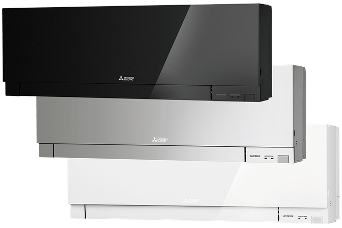 Three Mitsubishi air conditioning units in black, silver, and white, mounted on a wall.