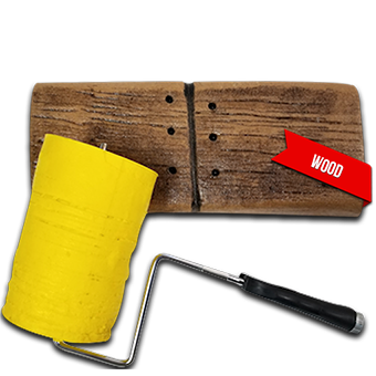 A yellow paint roller is sitting next to a wooden board