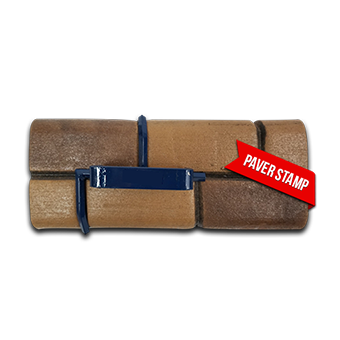 A paver stamp is attached to a brick wall