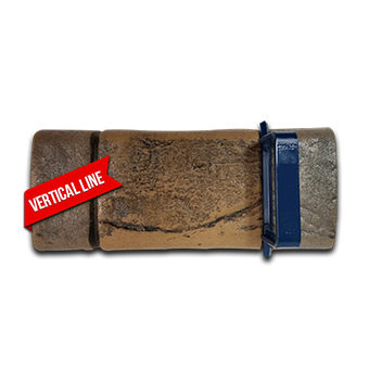 A brick with a red label that says vertical line