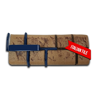 A brick with a red ribbon that says italian tile