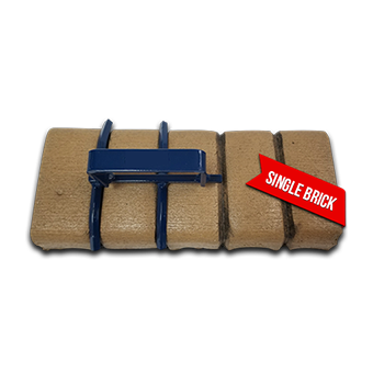 A single brick is sitting on a white surface