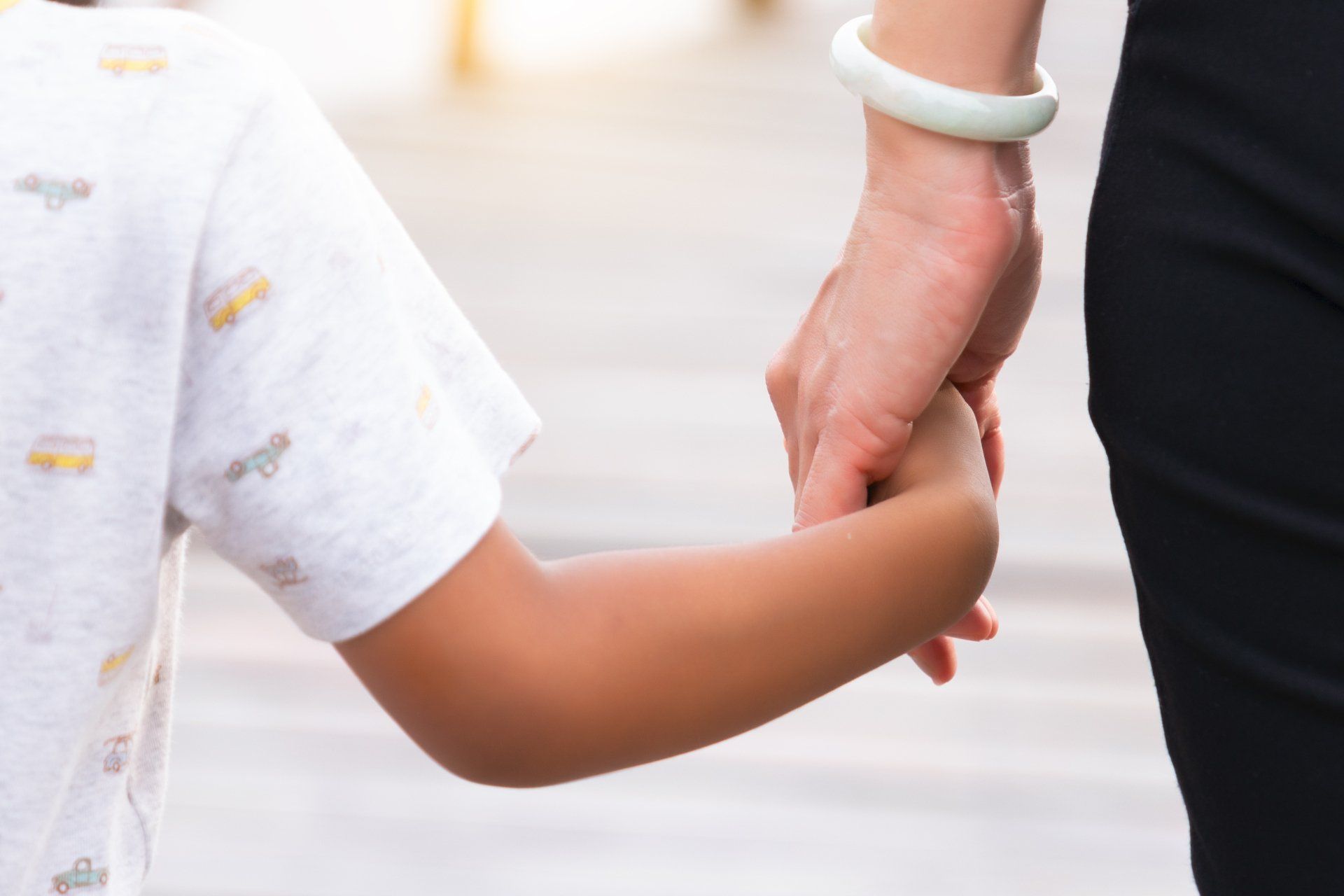 Girl Holding Her Mother's Hand — Seguin, TX — Guadalupe Valley Family Violence Shelter, Inc.