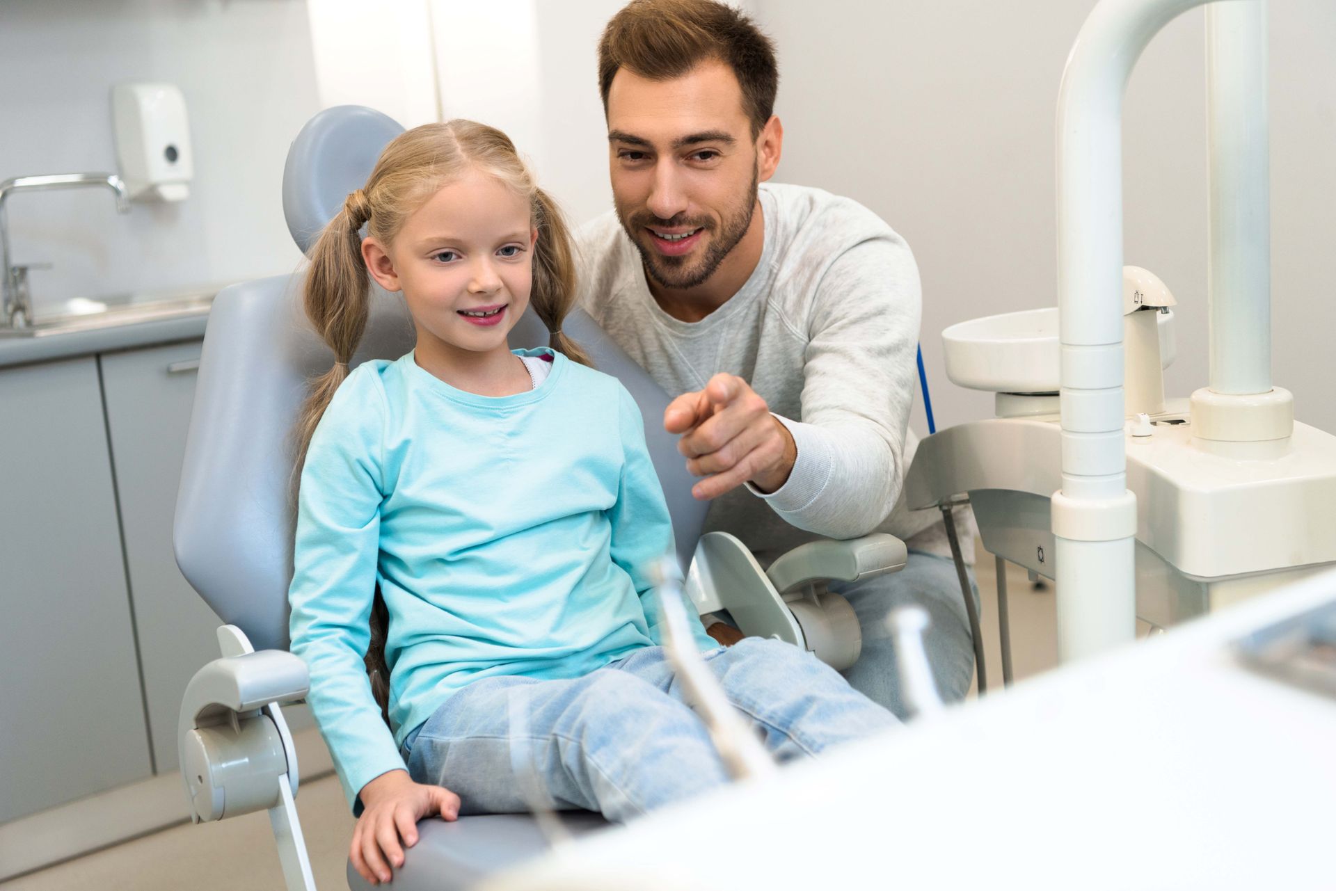 Father and daughter at the dentist