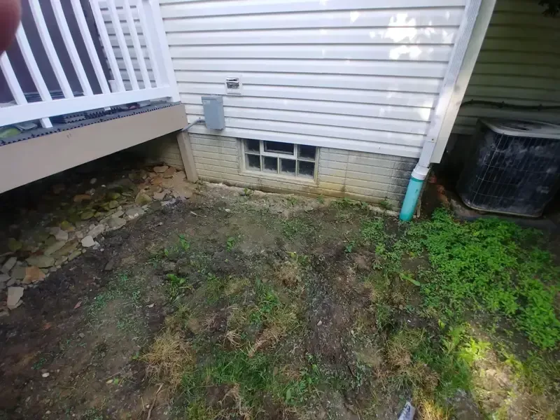 A white house with a window on the side of it