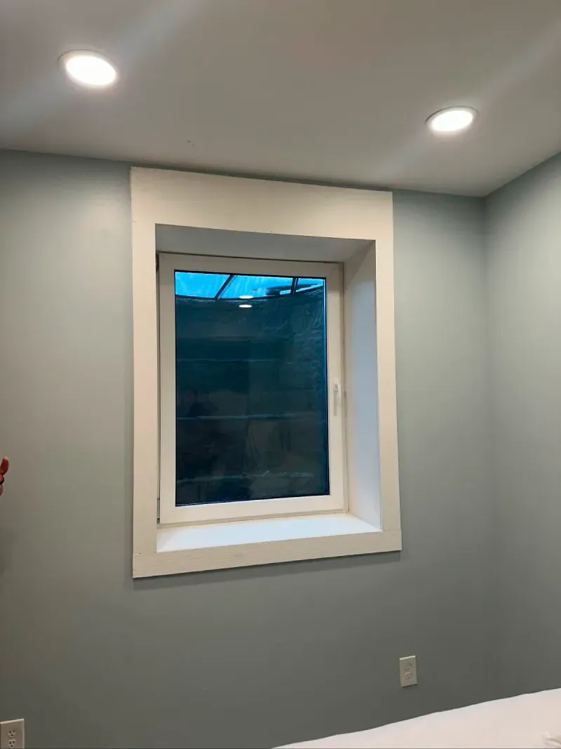 There is a window in the corner of the room.