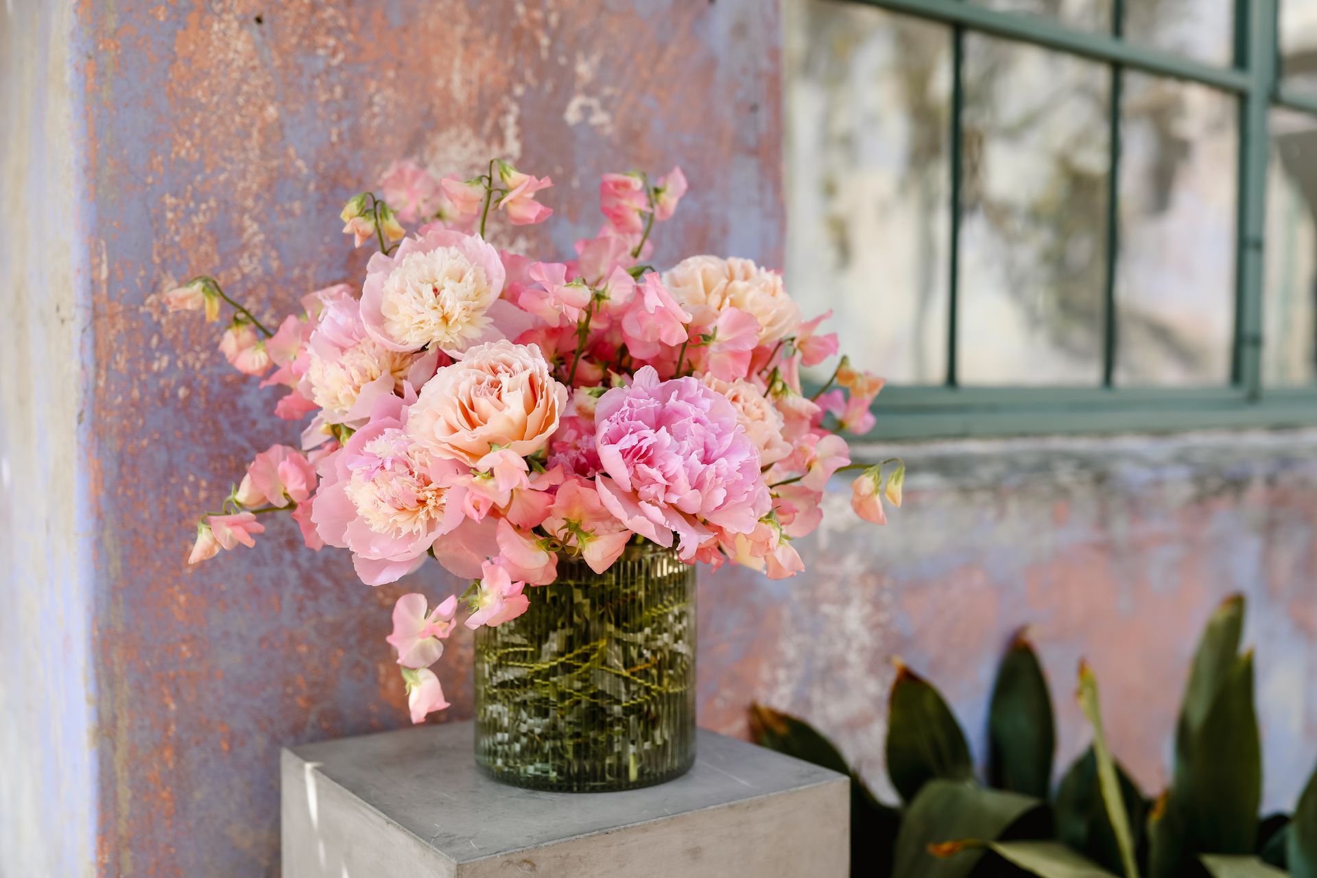 A flower arrangement to celebrate Mother's Day, Peaches and Pinks - featuring Peonies, Sweet Peas, and Garden Roses from Rose Story Farm