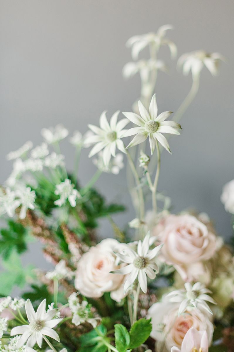 A close up of a bouquet of flowers on a table.