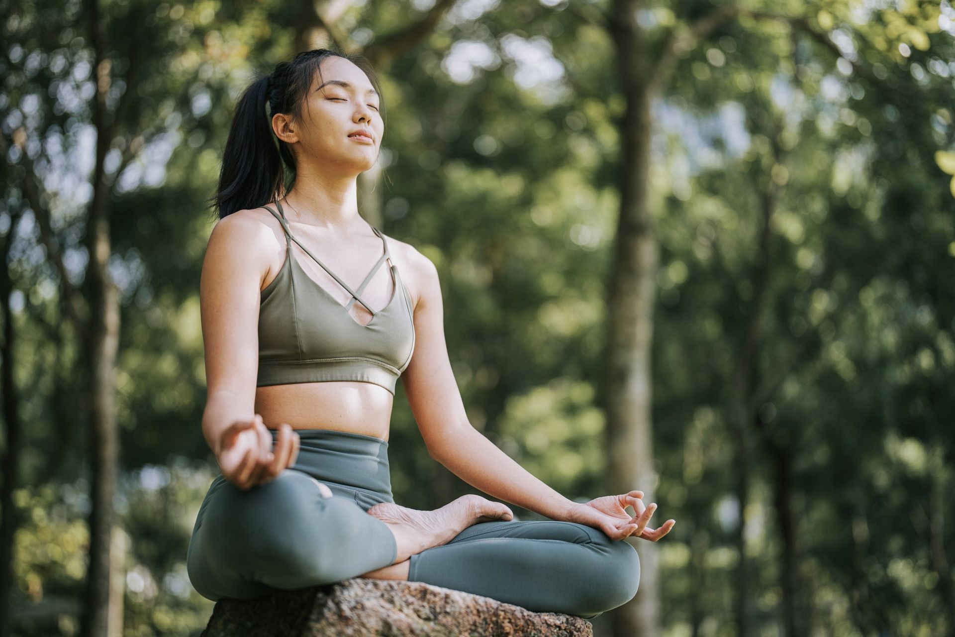 A woman is doing yoga for mental health.