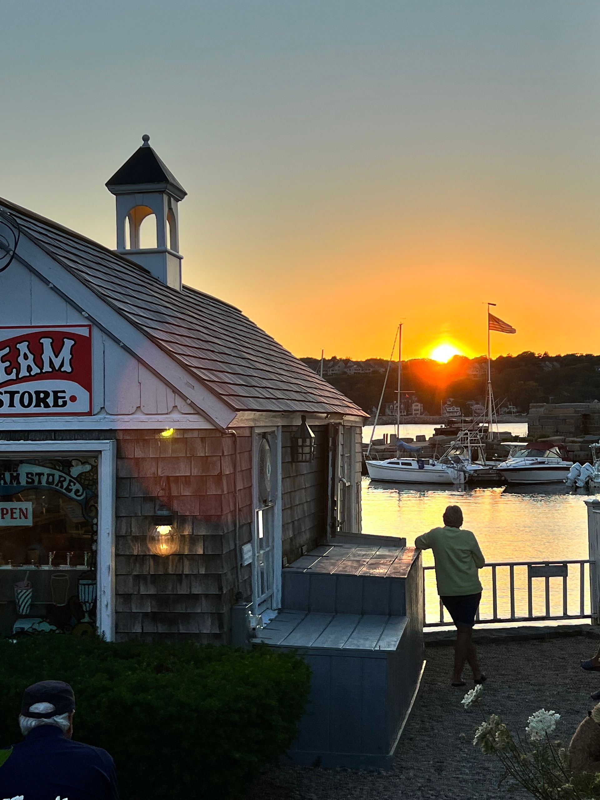 A man stands in front of a building that says ebm store