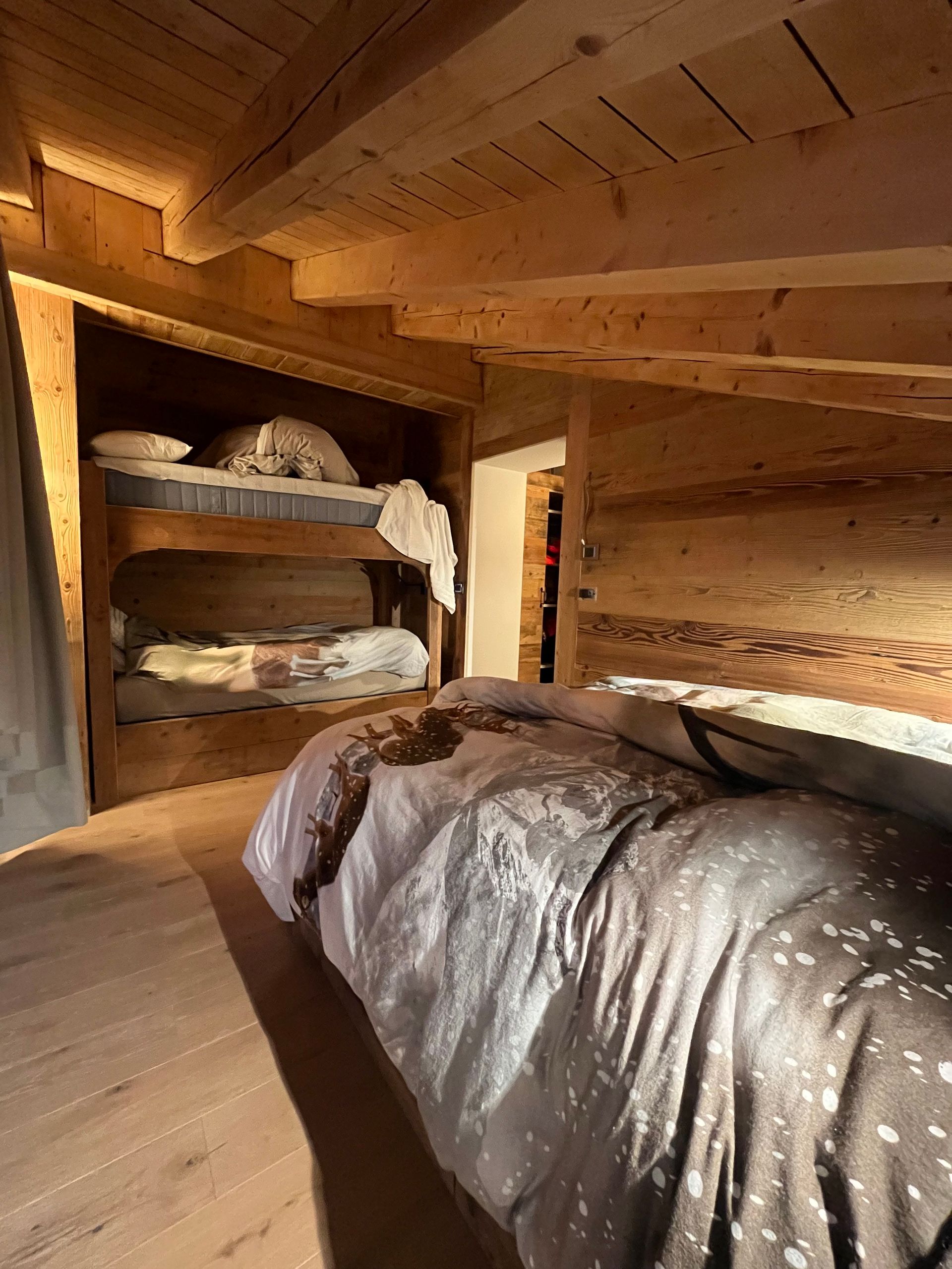 bedroom with a bunkbed and a queen sized double bed
