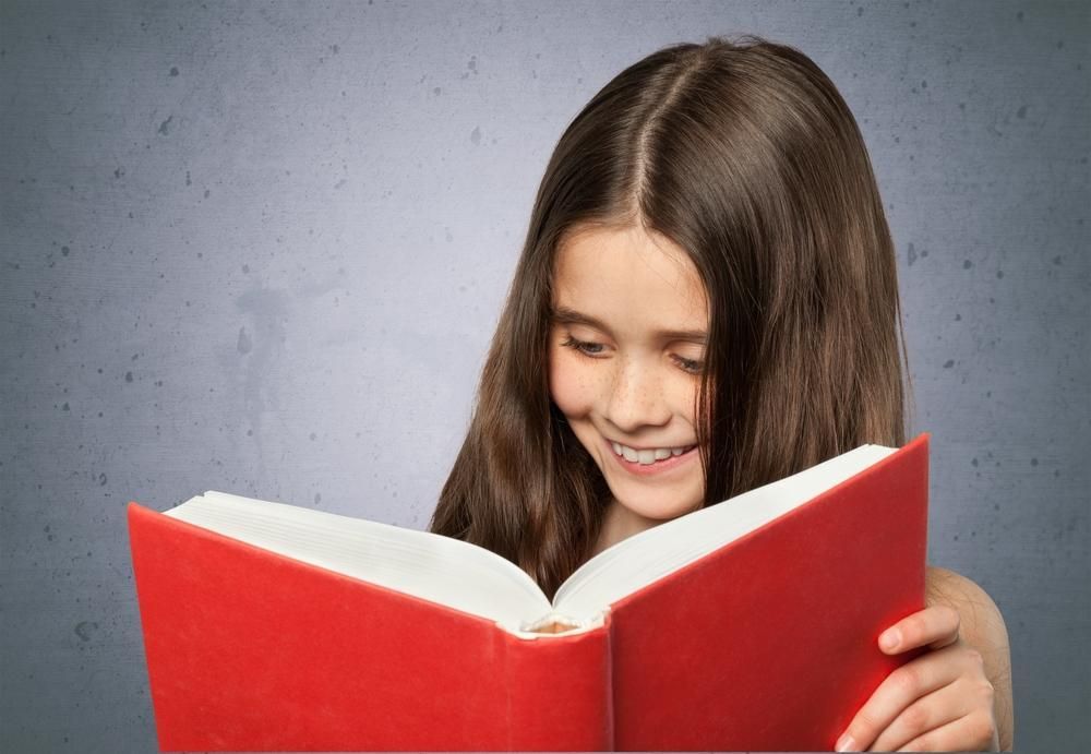 a Young Girl is Reading a Red Book — RIP IT UP Reading in Maitland, NSW