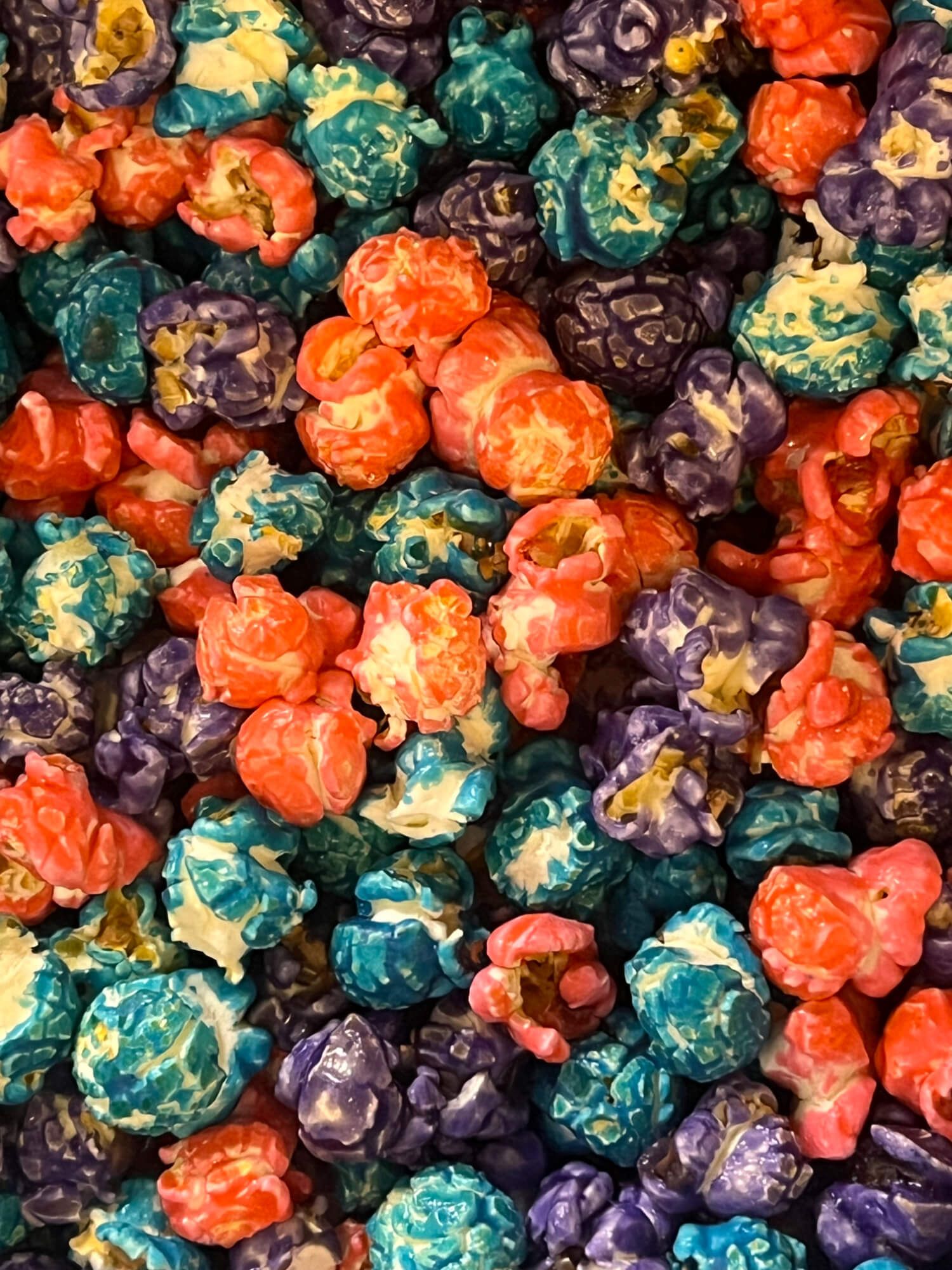 A close up of a pile of colorful popcorn