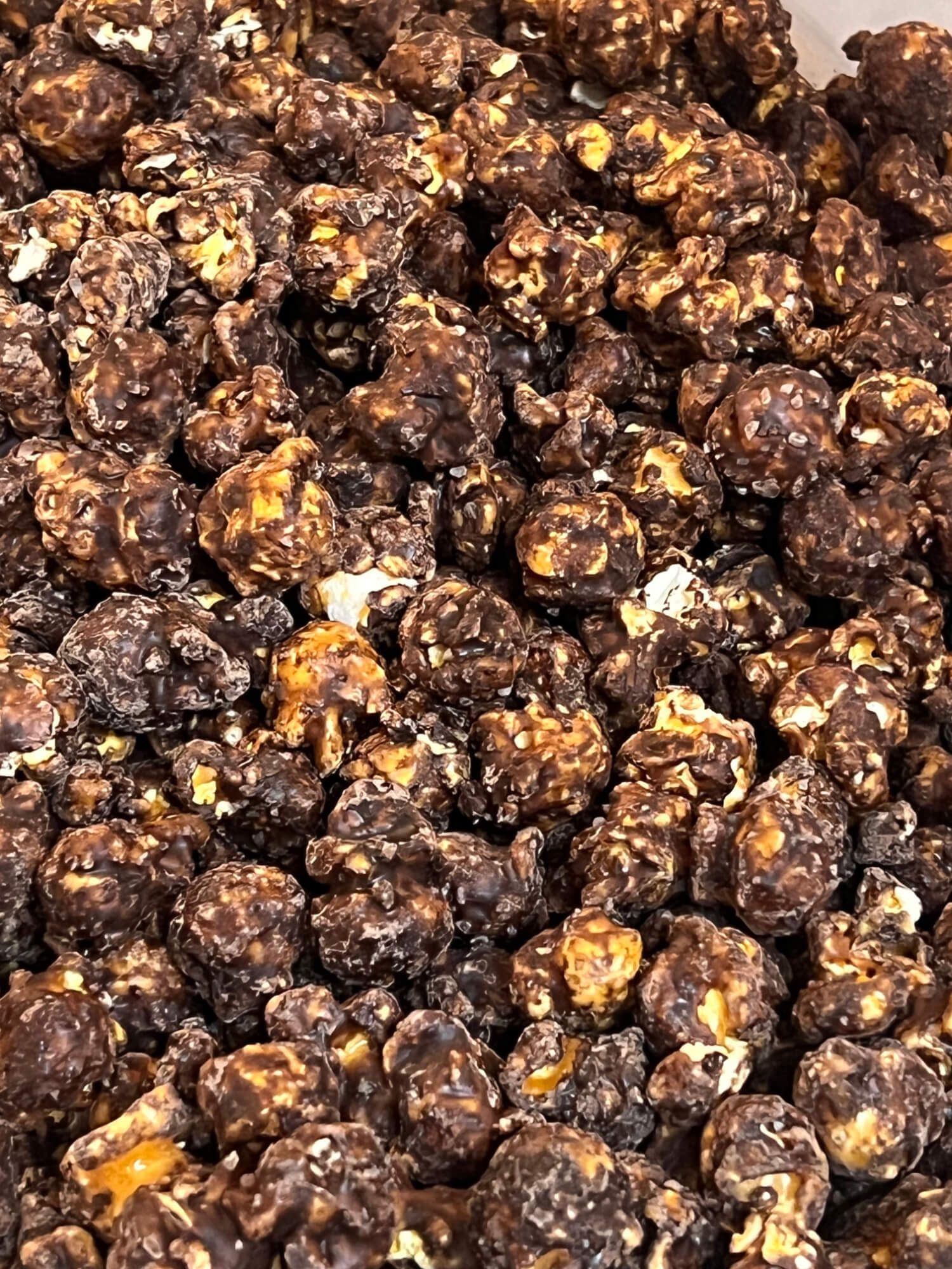 A close up of a pile of chocolate covered popcorn.