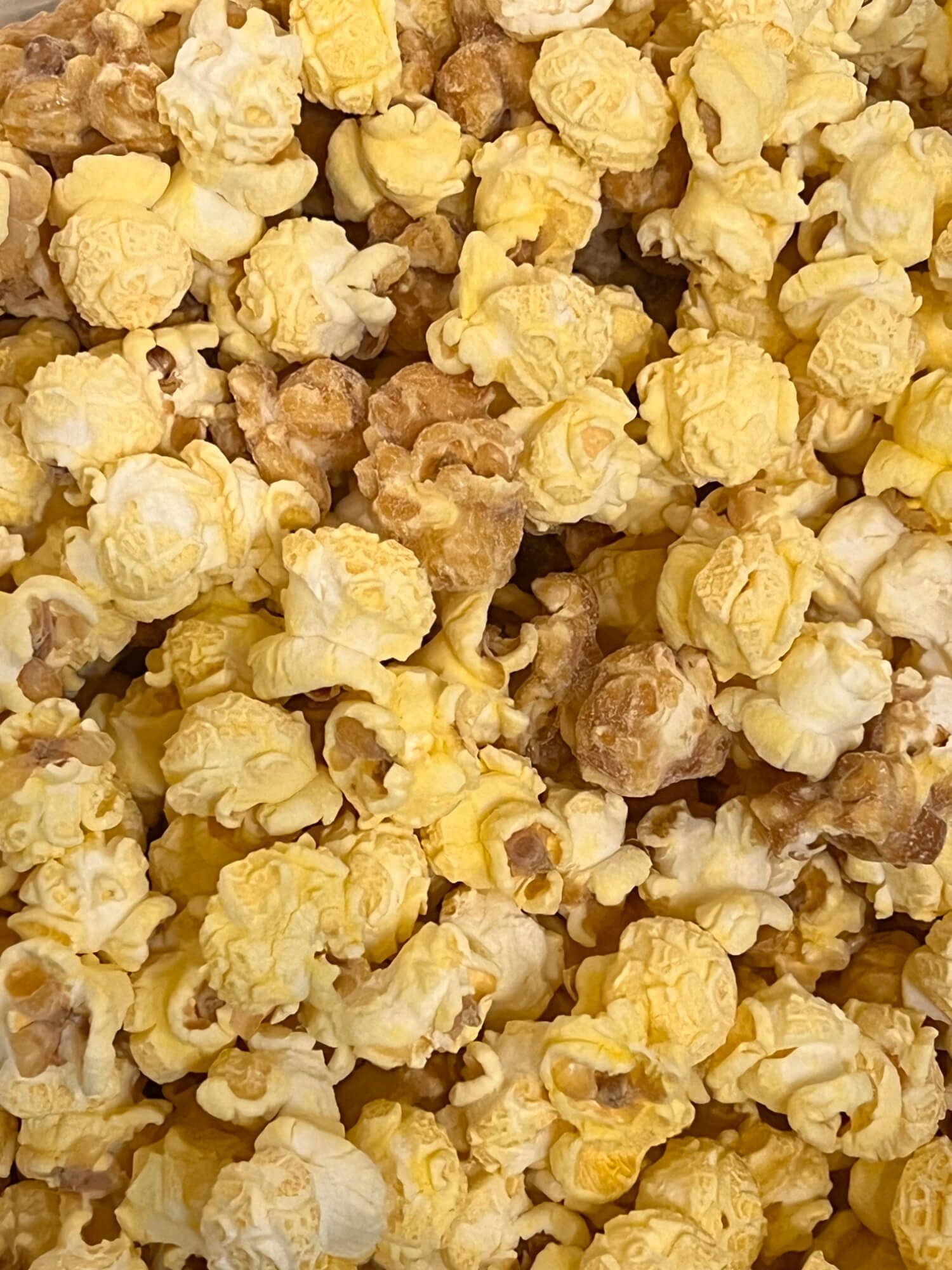 A close up of a pile of popcorn on a table.