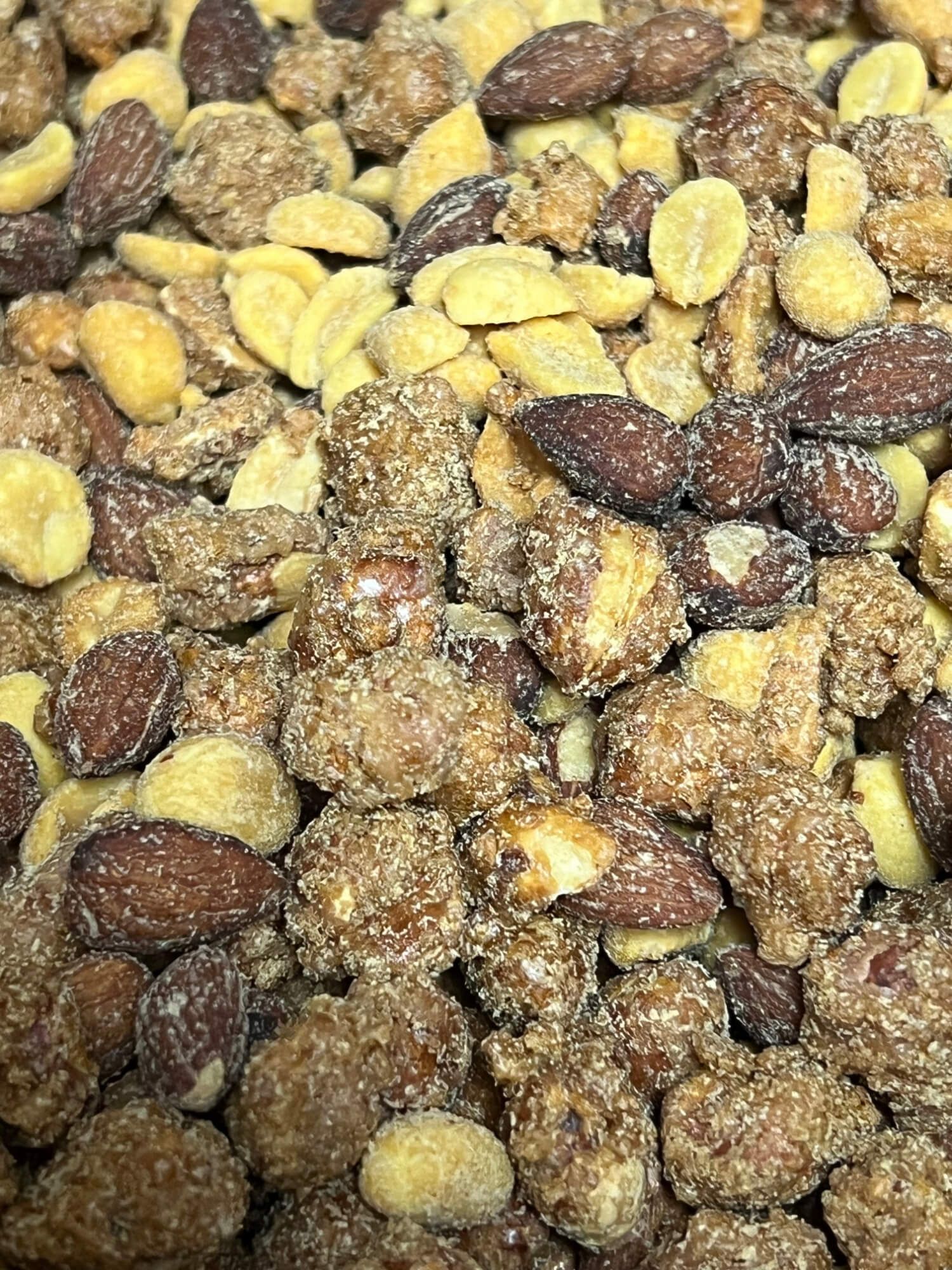 A close up of a pile of nuts on a table.