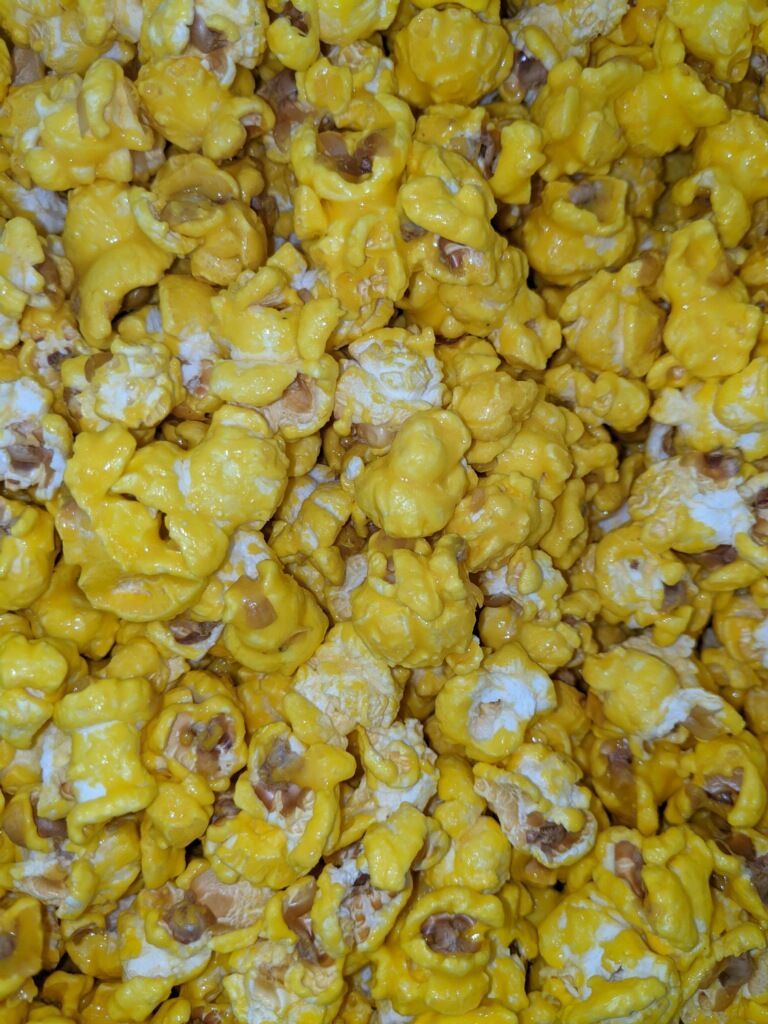 A close up of a pile of yellow popcorn.