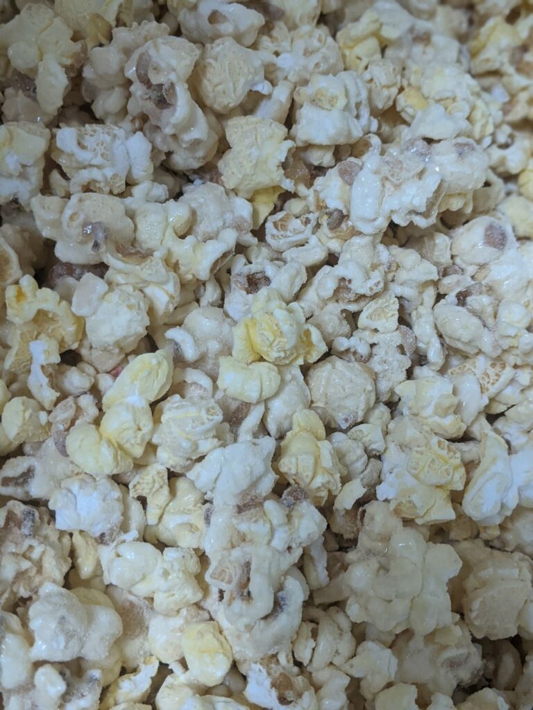 A close up of a pile of popcorn on a table.