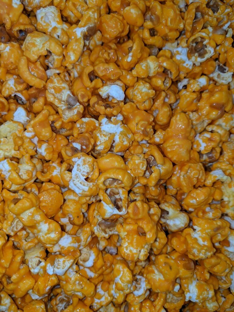 A close up of a pile of caramel popcorn.