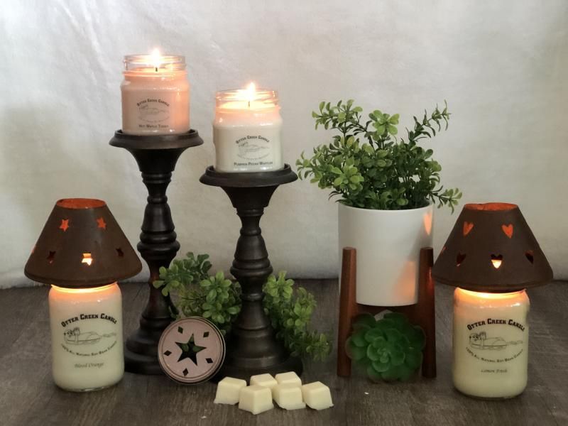 A group of candles sitting on top of a wooden table