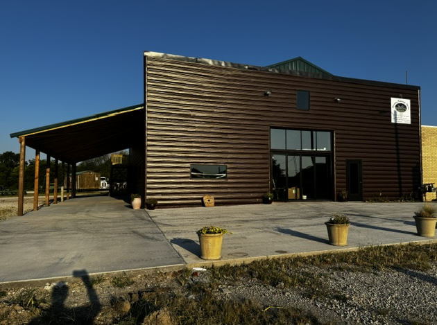 A large wooden building with a sign that says ' a ' on it