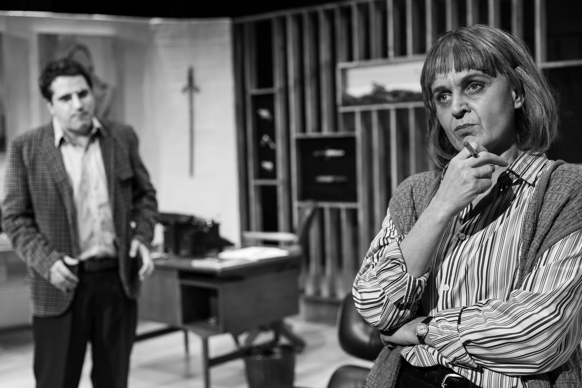 A man and a woman are standing next to each other in a room.