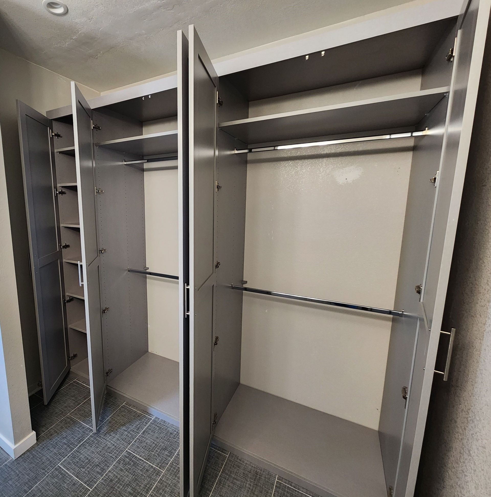The inside of a closet with the doors open