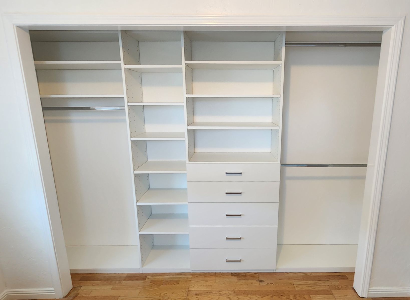 A closet with lots of shelves and drawers