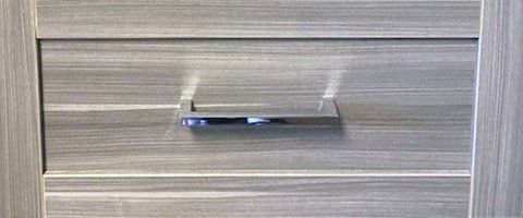 A close up of a door with a pen in it.
