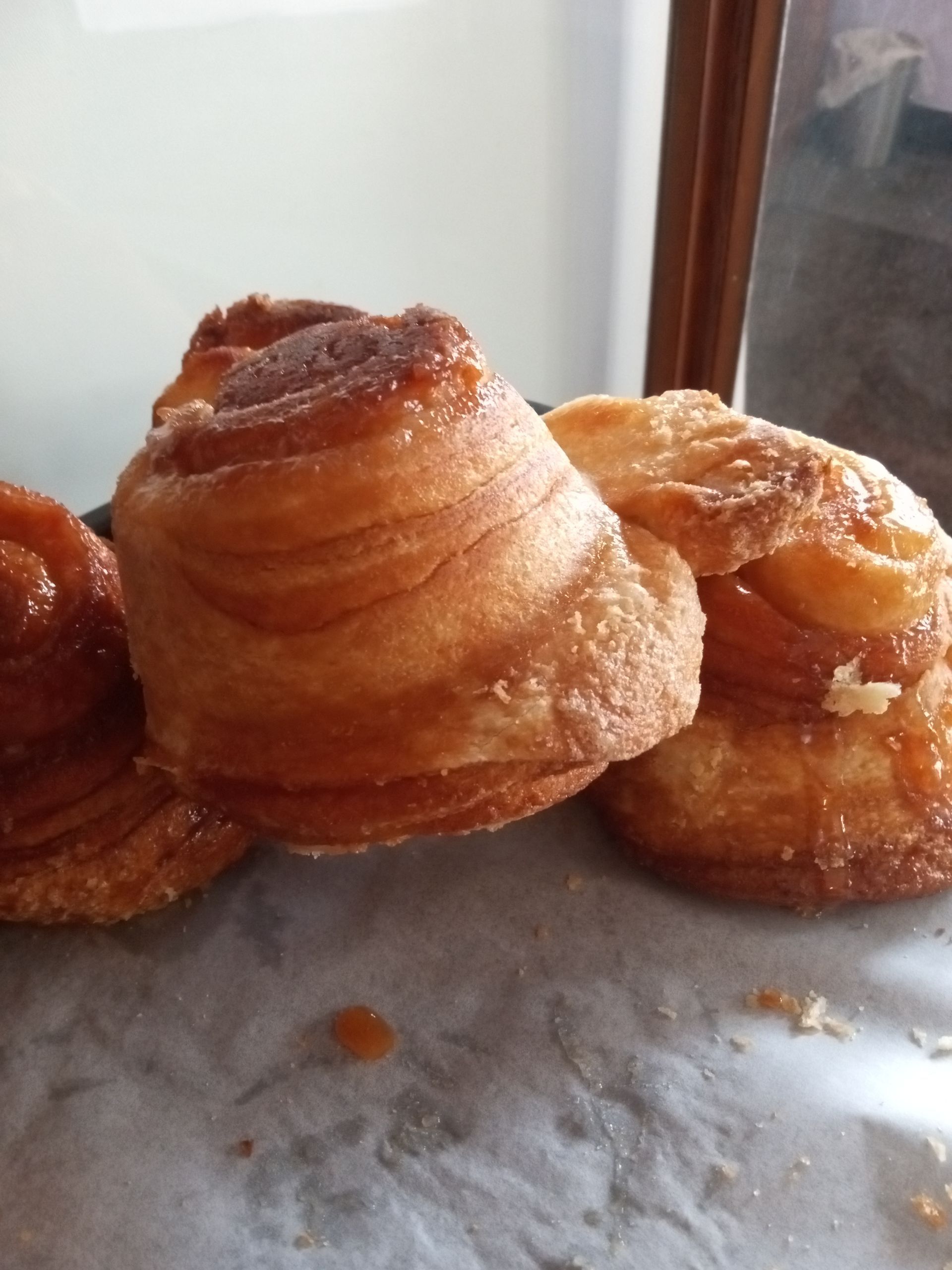 Three pastries are stacked on top of each other on a table