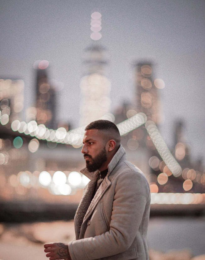 A picture of an Asian male with a full beard