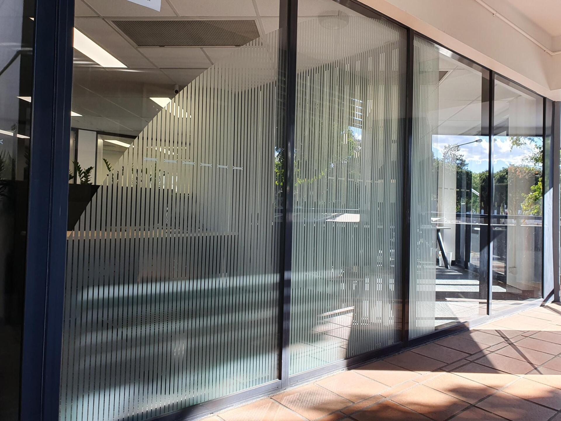 Modern Office Interior with Frosted Window Film — Solarmaster Brisbane in Murarrie, QLD