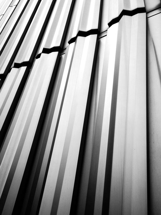 A black and white photo of a metal roof