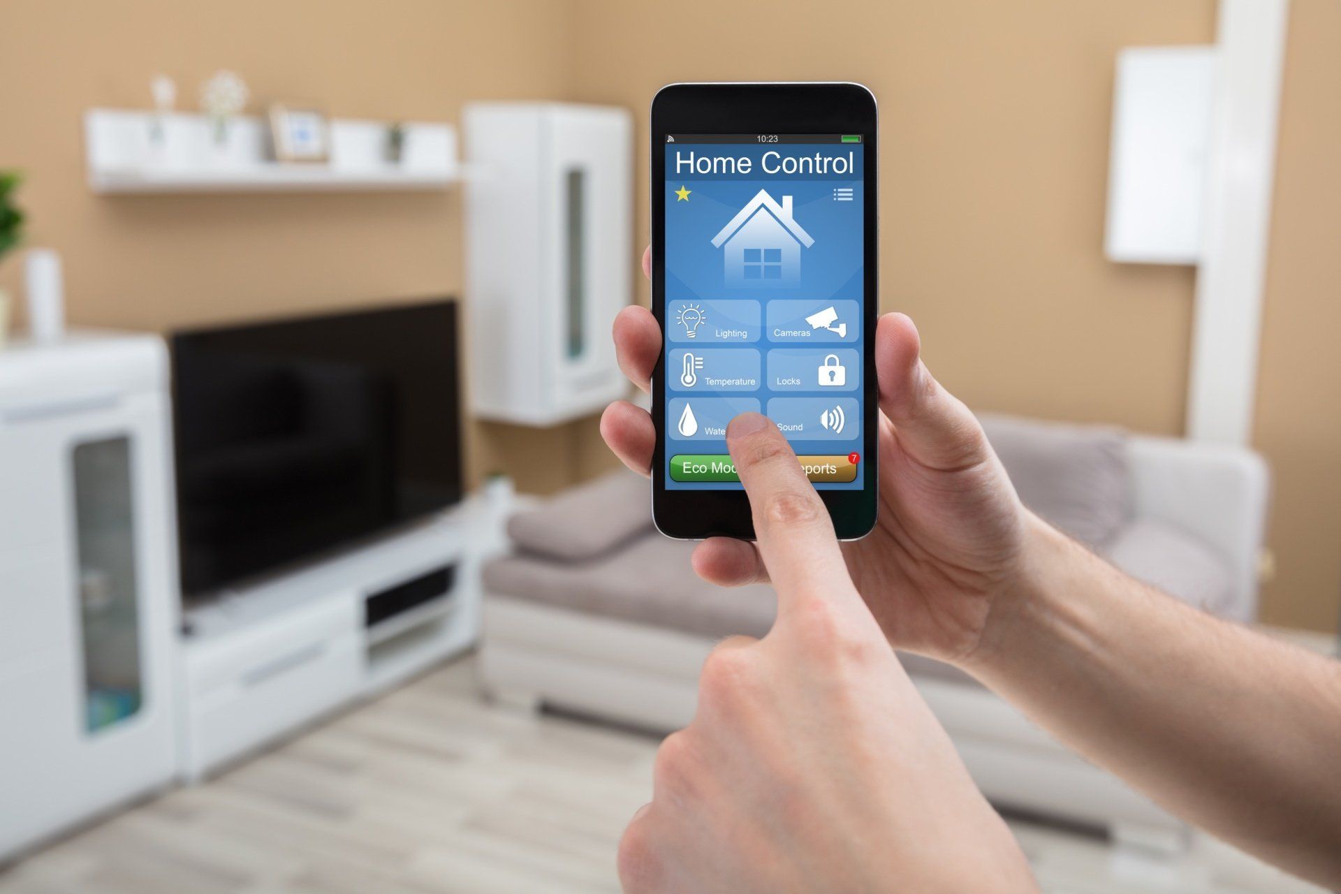 A person is using a smart phone to control their home.