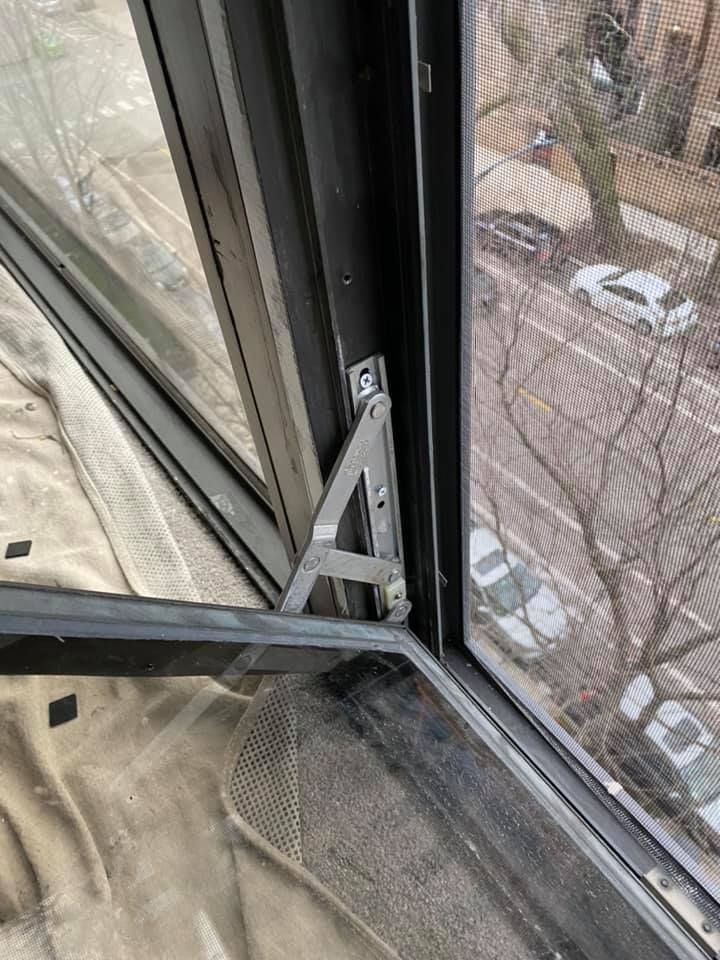 A close up of a window with a view of a city.