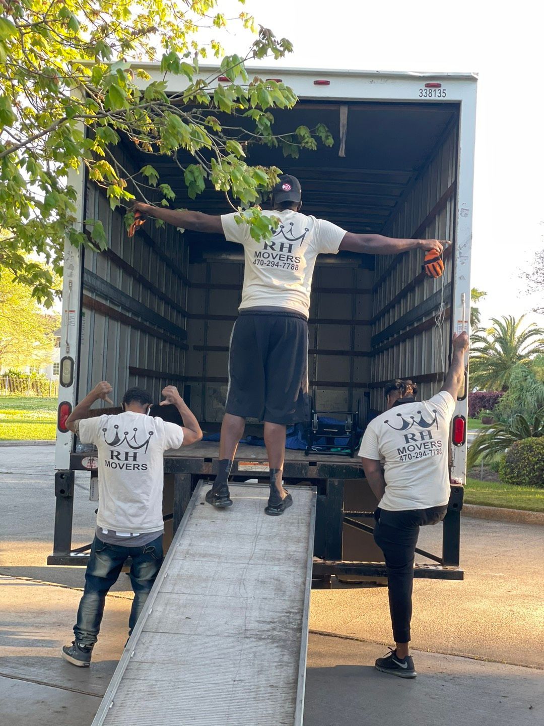 Woman Unpacking Things From Boxes With Cheerful Dancing | Atlanta, GA | Royal Haul Movers