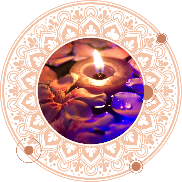 Floating candle in water, surrounded by flower petals, inside a decorative mandala.