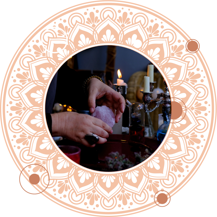 Hands holding a purple crystal over a bowl, lit by candles in a spiritual setting.