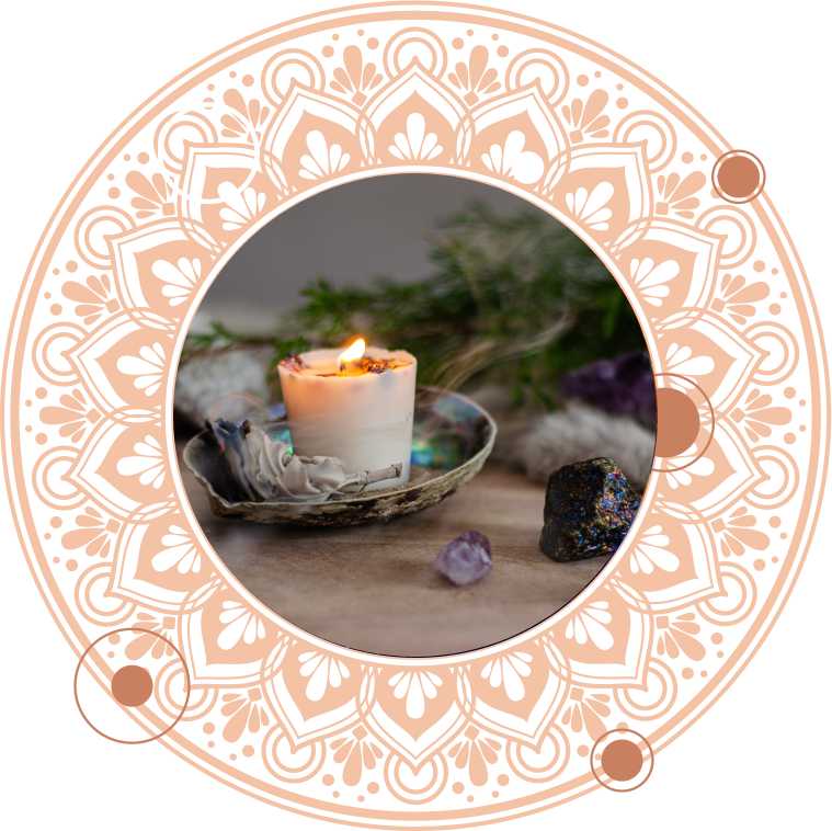 Candle burning in a dish with crystals, sage, and a mandala frame.